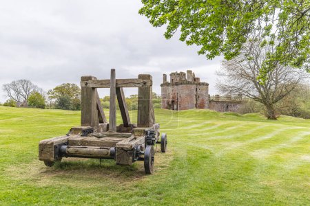Photo for Caerlaverock Castle, Dumfries, Dumfries and Galloway, Scotland, Great Briton, United Kingdom. May 3, 2022. Catapult at the 13th century ruins of Caerlaverock Castle. - Royalty Free Image