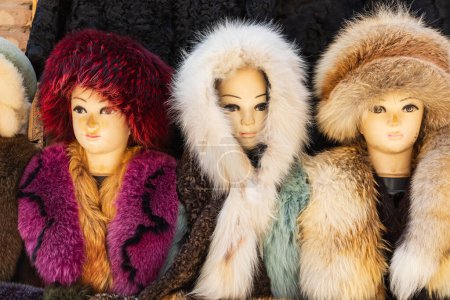 Khiva, Xorazm Region, Uzbekistan, Central Asia. Mannequins in furs at a store in Khiva.