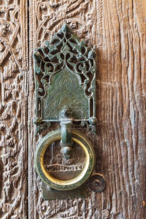 Khiva, Xorazm Region, Uzbekistan, Central Asia. Antique brass door knocker in Uzbekistan.