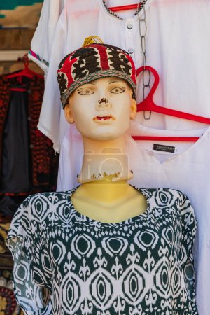 Khiva, Xorazm Region, Uzbekistan, Central Asia. Mannequin wearing a kufi skull cap in Khiva.