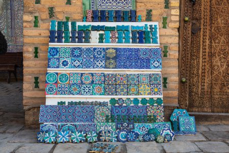 Khiva, Xorazm Region, Uzbekistan, Central Asia. Colorful decorative tiles and crafts for sale in Khiva.