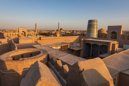 Khiva, Xorazm Region, Uzbekistan, Central Asia. The Islam Khodja Madrasa and Minaret, Kalta Minor Minaret, and Mohammad Rakhim Khan Madrasa in Khiva.