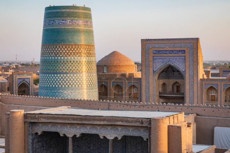 Khiva, Xorazm Region, Uzbekistan, Central Asia. The Kalta Minor Minaret and Mohammad Rakhim Khan Madrasa in Khiva.