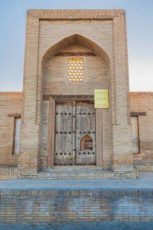 Photo for Bukhara, Uzbekistan, Central Asia. August 24, 2021. Entrance to the ancient Ahmadjon Caravansaray in Bukhara. - Royalty Free Image