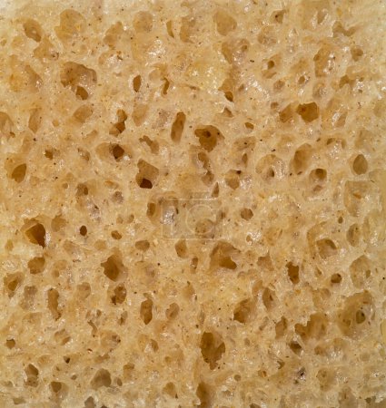 Téléchargez les photos : La texture du pain complet comme fond, gros plan. Macro photo. - en image libre de droit