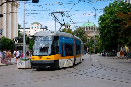 Photo for Sofia, Bulgaria. August 19, 2023. View of a new tramway near Vitosha Boulevard. Sveta Nedelya Cathedral Church in the background - Royalty Free Image