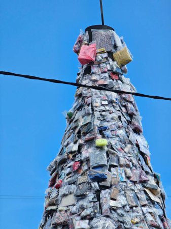 A towering 5-meter-high tower constructed from merchandise items like clothing, hats, wallets, bags, etc., adding vibrancy to the festival atmosphere.