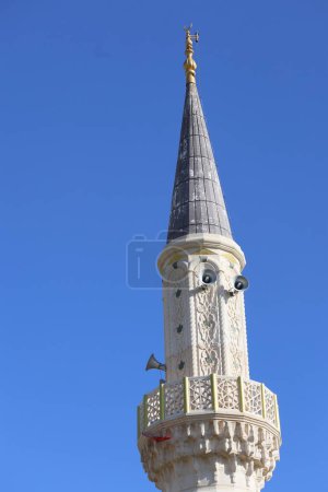 minaret of a mosque with islamic engravings