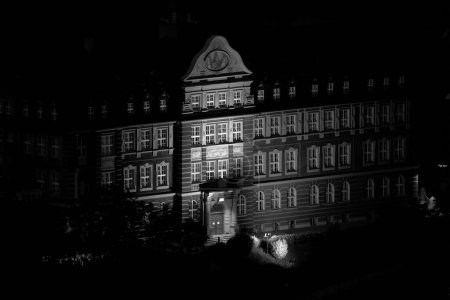 Black and white photo of the convent Institute St. Josef of the Sisters of Mercy of the Holy Cross in Feldkirch in the evening.