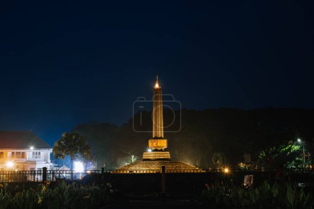 Photo for Tugu Malang at night. Main landmark and tourist icon of Malang City in East Java, Indonesia. Malang Town Square. - Royalty Free Image