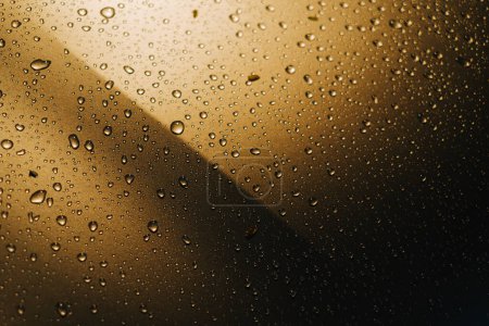 Photo for Raindrops on the car with bokeh foreground and background - Royalty Free Image