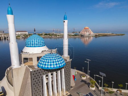 Photo for Aerial view of Amirul Mukminin Mosque, a Floating Mosque in Makassar, located in famous tourist destination, Losari Beach, South Sulawesi, Indonesia. New landmark of Makassar City. - Royalty Free Image