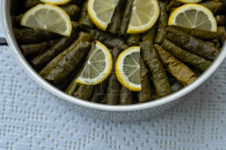 Téléchargez les photos : Traditional delicious Turkish foods , stuffed leaves ,traditional turkish dish made from rice wrapped in grape leaves. High quality photo - en image libre de droit