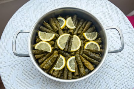 Téléchargez les photos : Traditional delicious Turkish foods , stuffed leaves ,traditional turkish dish made from rice wrapped in grape leaves , top view. High quality photo - en image libre de droit
