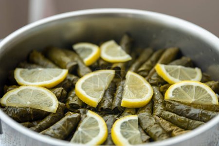 Téléchargez les photos : Traditional delicious Turkish foods , stuffed leaves ,traditional turkish dish made from rice wrapped in grape leaves. High quality photo - en image libre de droit
