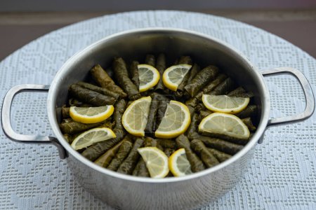 Foto de Traditional delicious Turkish foods , stuffed leaves ,traditional turkish dish made from rice wrapped in grape leaves. High quality photo - Imagen libre de derechos