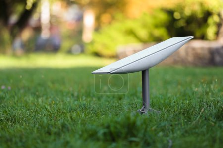 Photo for Starlink satellite-based (Satellite internet constellation) on the lawn of the park during the day - Royalty Free Image