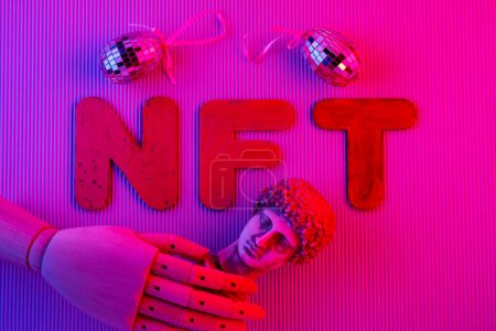 NFT symbol abstract concept in pink neon light. Non-fungible token, antique sculpture, artificial hand and mirror eggs. Crypto Art