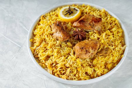 Indian Chicken Biryani with Spices served on Plate, Close-up