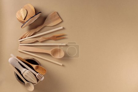 Wooden Kitchen Utensils Collection on Beige Background, Top View, Copy Space