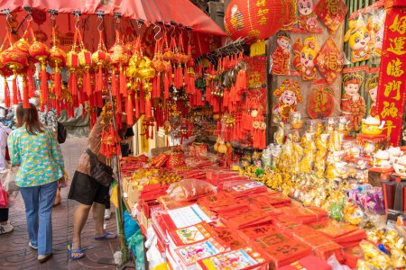 Photo for Yaowarat street during Chinese New Year festival celebrates holidays in Chinese culture shop sale red china traditional lantern clothes: 19 January 2023, Bangkok, THAILAND. - Royalty Free Image