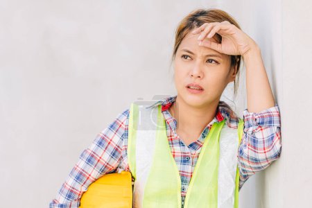 Tired stress woman worker Asian engineer lady exhausted feel bad expression