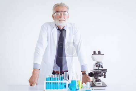 Photo for Portrait Doctor senior elderly scientist chemist standing in chemical science lap with microscope - Royalty Free Image