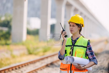 Engineer caucasian women railway tracks service team working on site survey check maintenance inspection train track for construction and safety