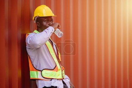 Photo for African black worker male brake relax drinking water for refreshing from hard working in hot day summer season - Royalty Free Image