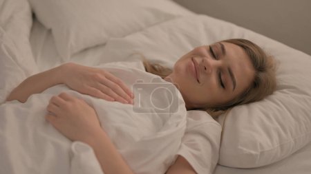 Photo for Tired Young Woman Lying in Bed to Sleep - Royalty Free Image