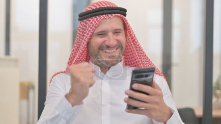 Portrait of Arab Man Using Phone