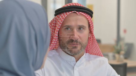 Close up of Arab Man Talking with Arab Woman