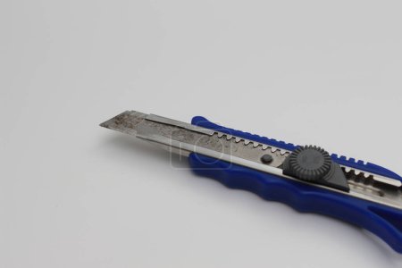 a close up of a blue cutter isolated on a white background. product photo concept.