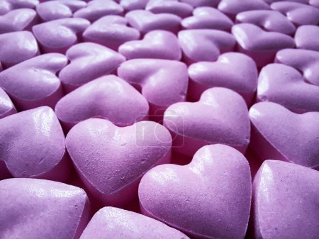 Photo for Background of sweets in heart shaped close-up. Defocused. Template with selective focus for advertising, flyer, website design, packaging, cover on theme of love, wedding, date, valentine's day - Royalty Free Image