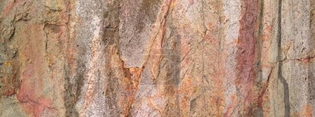 Foto de Fondo para pancarta con textura de piedra natural en colores amarillo, naranja, gris. Fragmento de roca con gradiente de diferentes colores. Plantilla para diseño, portada, fondo de foto. - Imagen libre de derechos