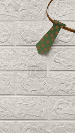 Photo for Tie on white brick wall background. Place for text. Paper garland with green tie with brown circles. Concept of business style, dress code, professional holiday. Father's Day, Day of lawyer. - Royalty Free Image