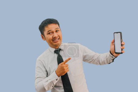Side View A man showing excited while pointing to blank phone screen that he hold