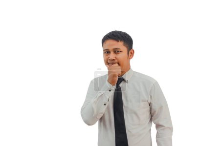 Foto de Asiático hombre de negocios pensando en algo mientras mira al frente - Imagen libre de derechos