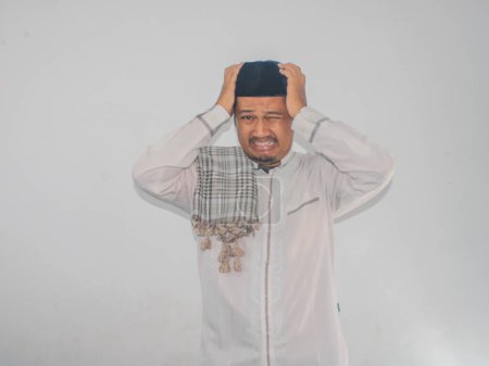 Muslim Asian man showing stressed expression isolated on white background