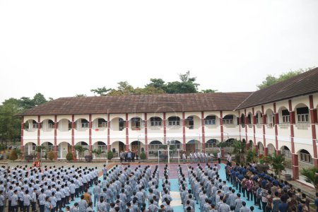Photo for Subang, Indonesia - May 2024: Middle school, high school students and teachers taking part in a ceremony to commemorate National Education Day on the school field - Royalty Free Image