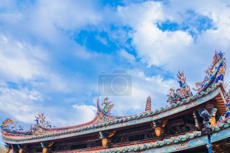 the ornately decorated roof of a traditional temple