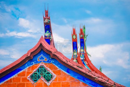 the ornately decorated roof of a traditional temple
