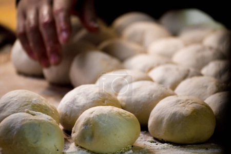 the process of kneading dough by hand