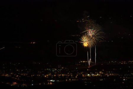 Photo for Fourth of July Skyrockets, seen from above, Cottonwood, Arizona. City is in the foreground. - Royalty Free Image