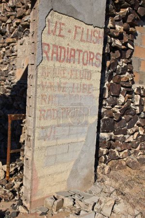 Photo for Sign on old, destroyed, car repair shop, Vicksburg, Arizona on US60. - Royalty Free Image