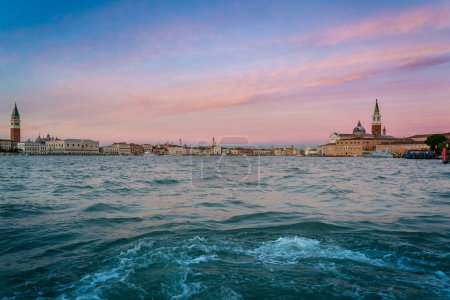 Photo for View of Venice Grand Canal and Santa Maria della Salute church in the evening and sunset. Piazza San Marco from river. Gondola and boats traditional. Carnival and mask. Italy holidays on winter. Christmas. - Royalty Free Image