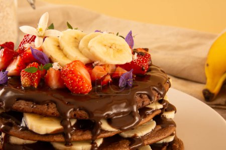 Fit Banana Pancake Stack with Strawberry and Hazelnut Cream, horizontal crop closeup