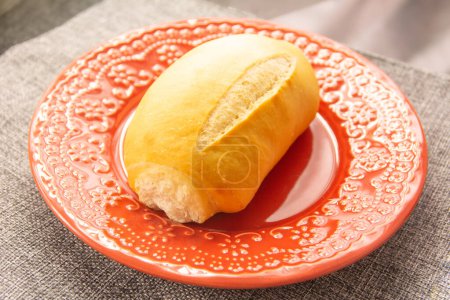 "French bread" traditional Brazilian bread in a red plate