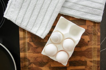 White chicken eggs in ceramic tray
