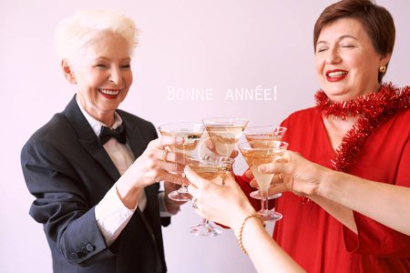 Photo for New year celebrating hands with glasses of white sparkling wine. Christmas, family, friends, celebrating, new year concept - Royalty Free Image